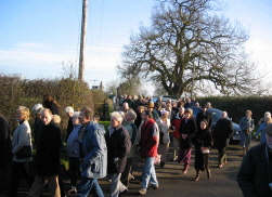 A huge crowd walks to the crash site